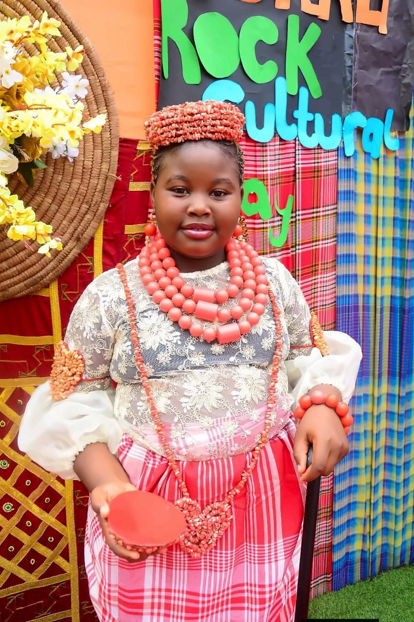 A pupil in traditional attire and coral beads on Cultural Day